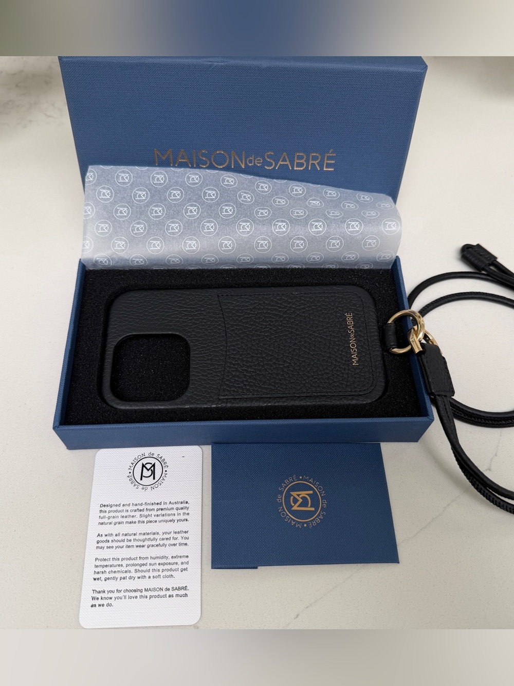 Maison de Sabre Sling Phone Case iPhone 14 Pro in Black Caviar and Gold Hardware